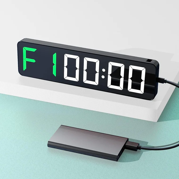Portable interval timer beside a power bank